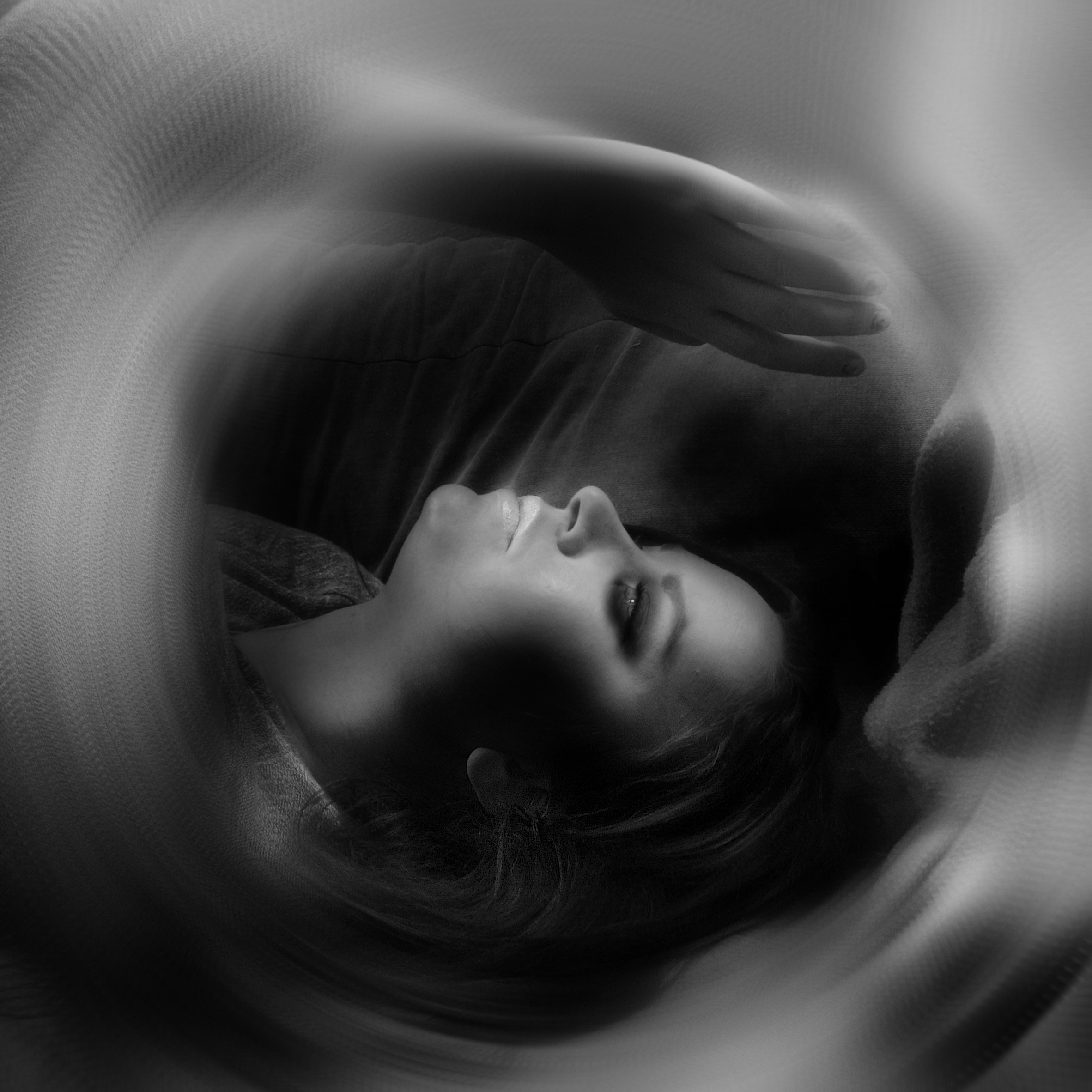 Black and white image of girl with special affects around her.