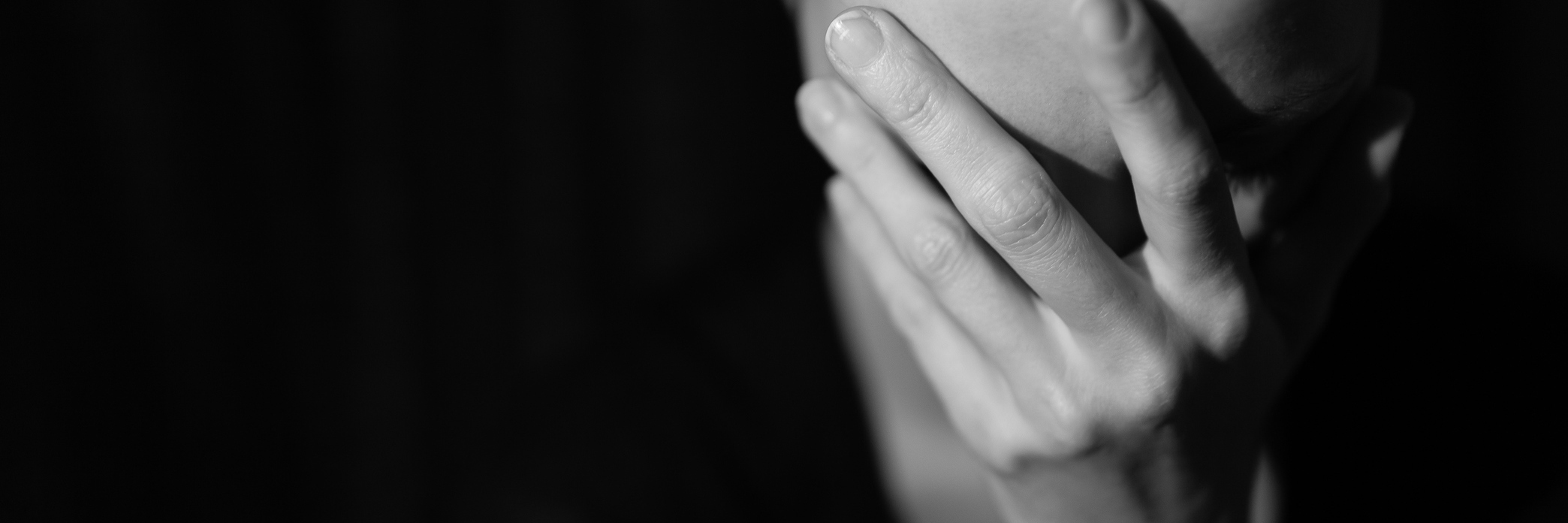 8 Things I Want People Who Think I'm 'Exaggerating' My Fatigue to Know Tired woman with her head in her hand.