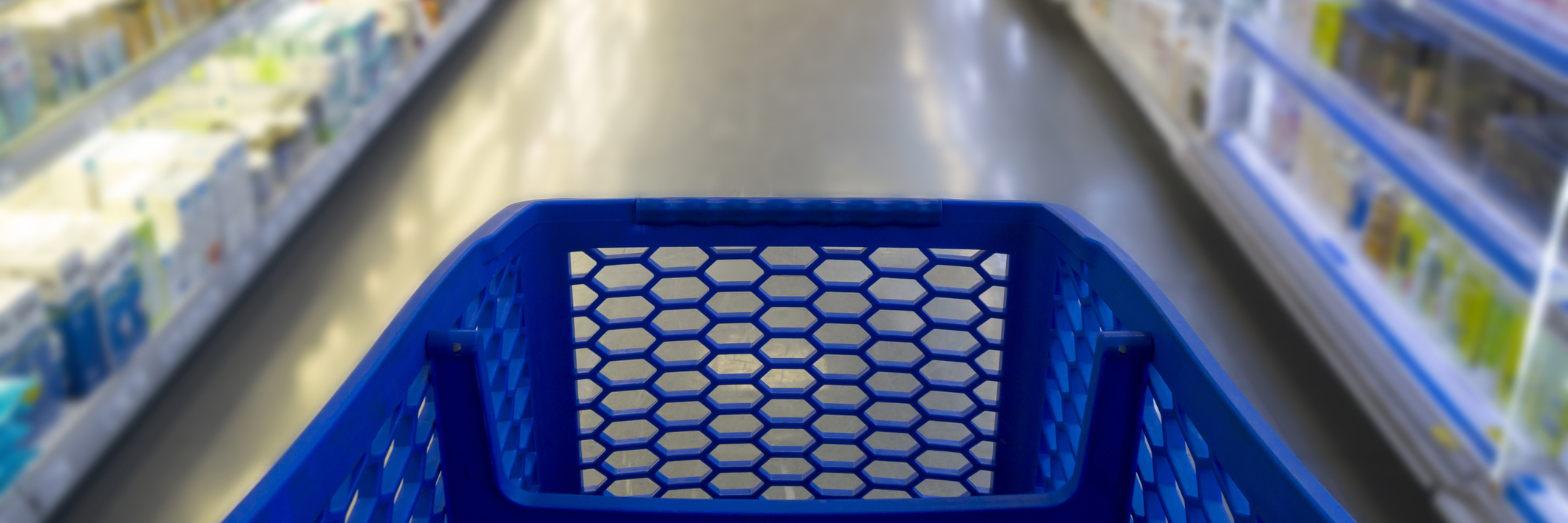 A blue shopping cart in a store.