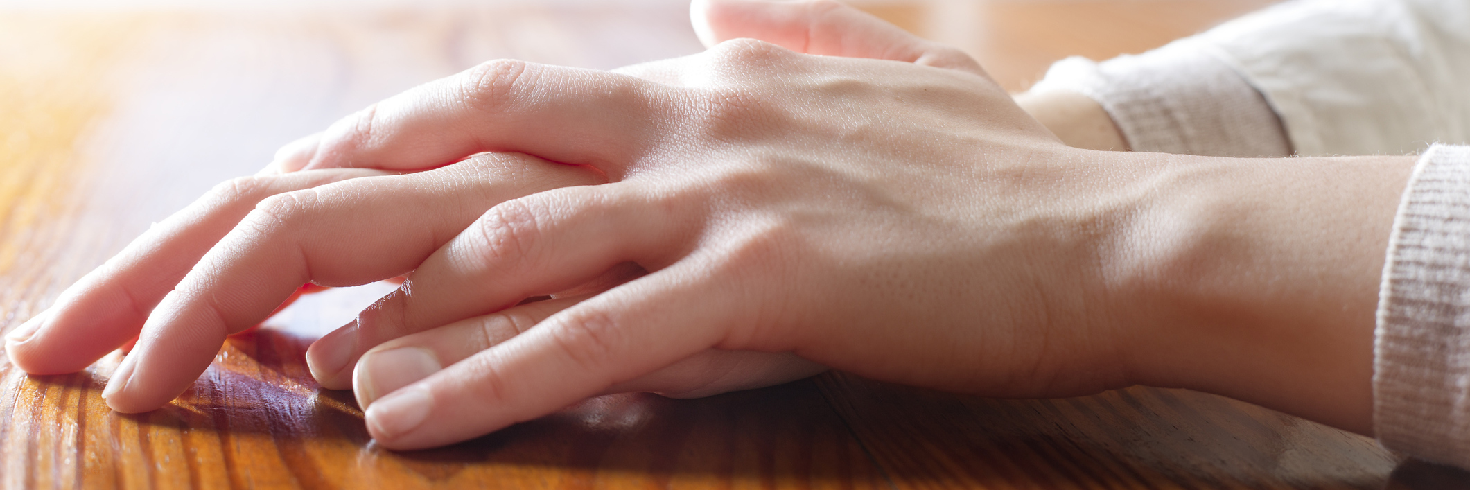 How Acknowledging My Skin Picking Has Affected Me woman's hands on wooden table
