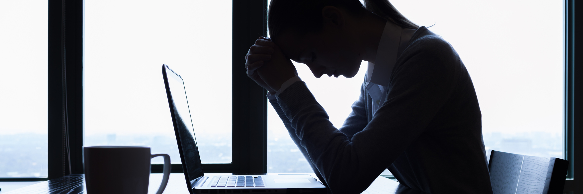 Woman Responds to Supervisor Who Shamed Her for Period Pain Silhouette of stressed businesswoman in the office.