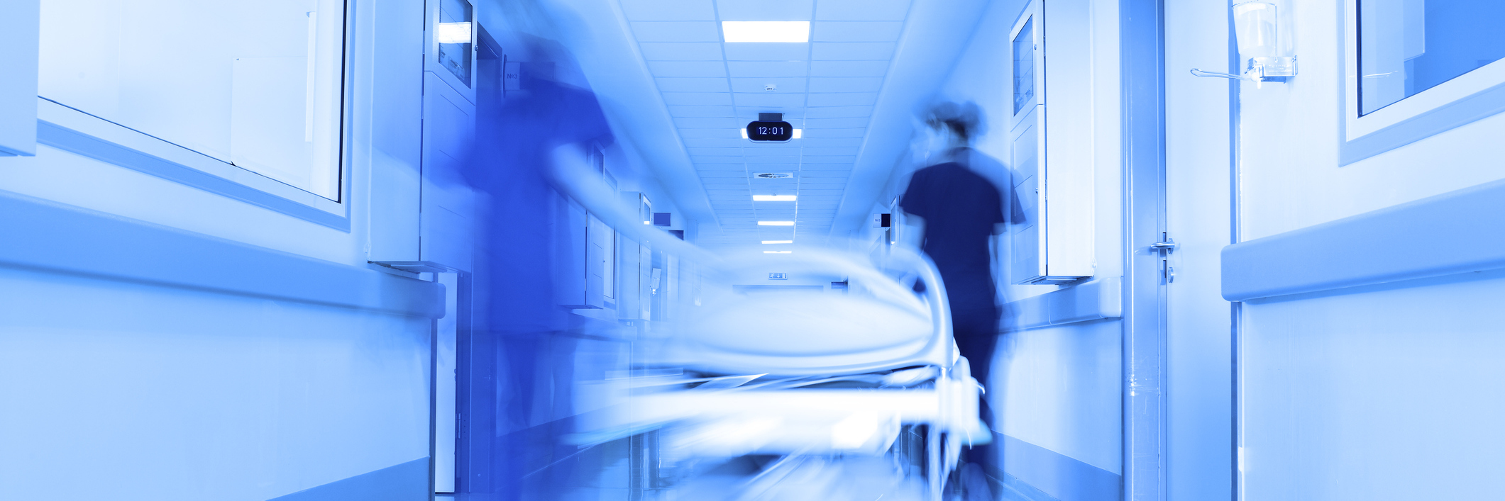 What It's Like Receiving Treatments for My Port-Wine Stain Birthmark A hospital bed being wheeled down a hallway.