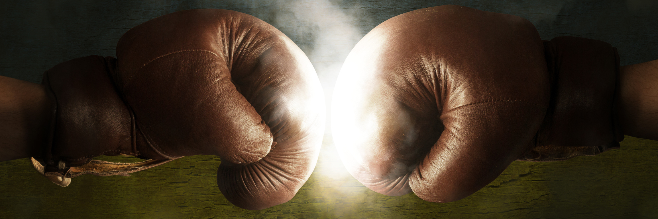A Day With Fibromyalgia Is Like Fighting an Opponent in a Boxing Ring two boxing gloves meeting in a fight
