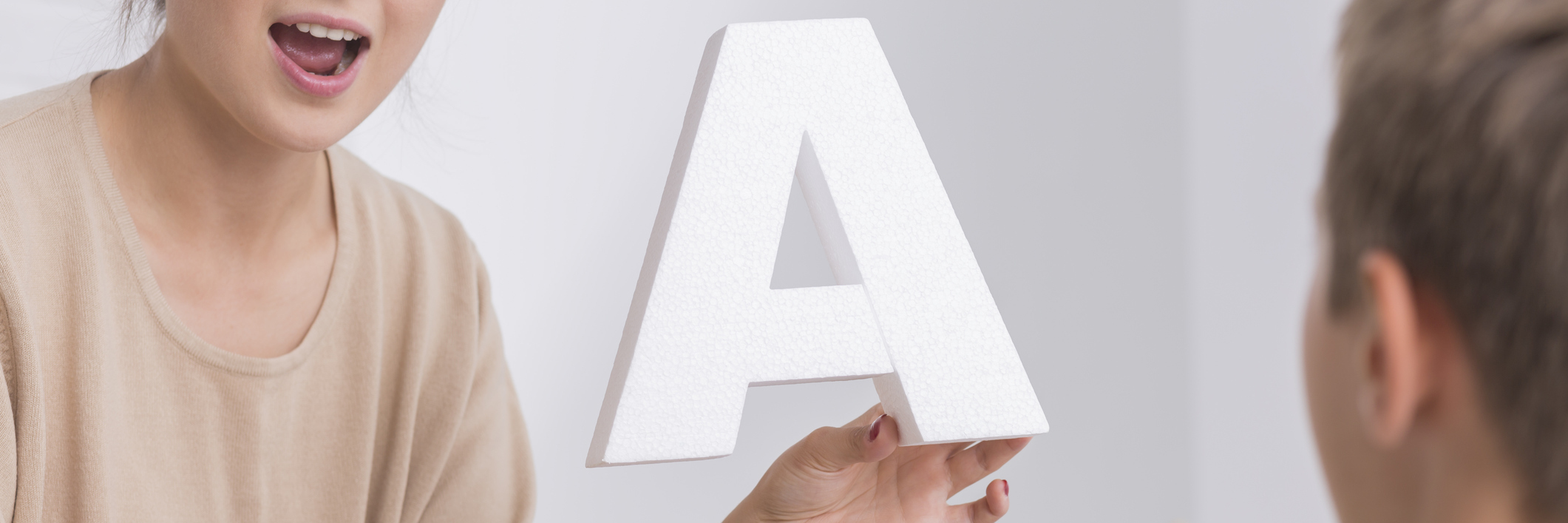 Finding Acceptance With a Speech Impediment Child with speech therapist.