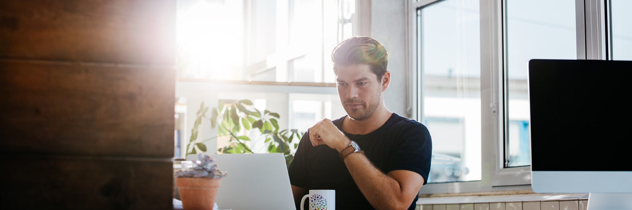 An Open Letter to My Congenital Heart Disease A young man sitting at a computer.