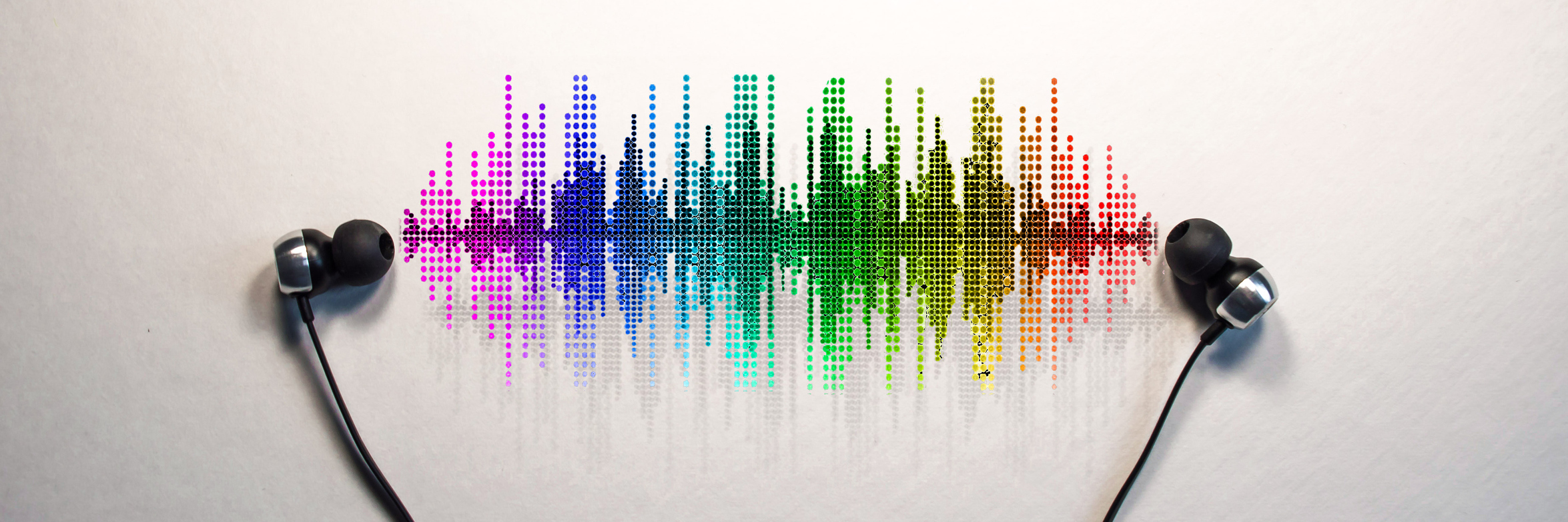 10 Songs for Tough Days With Chronic Illness Headphones placed down with visual sound wave.