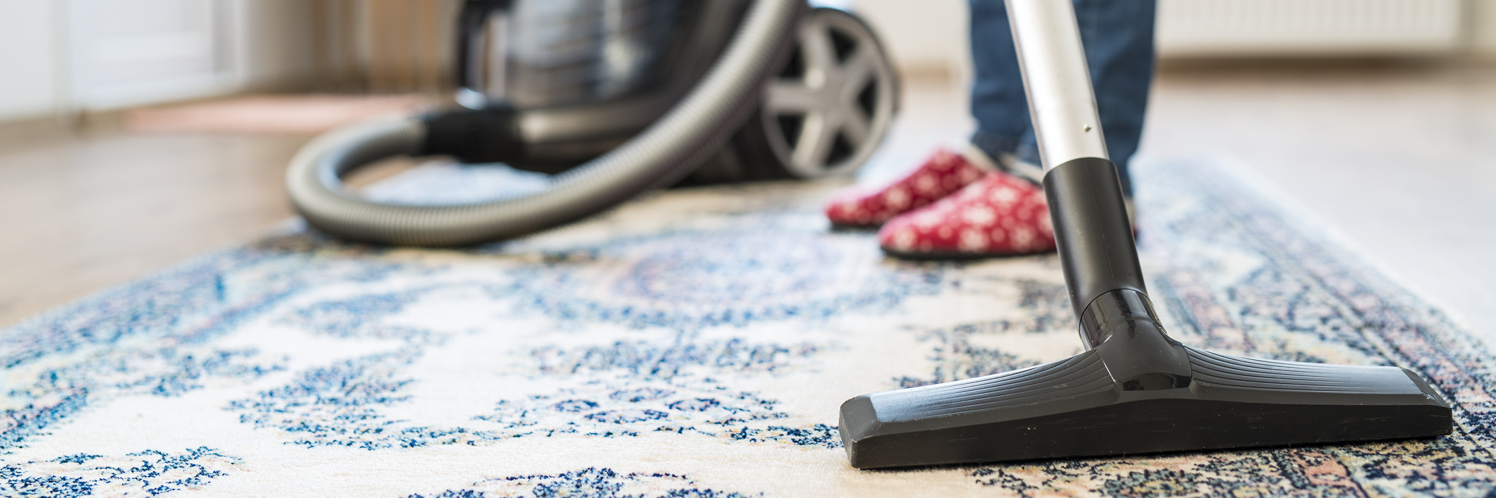 woman vacuuming her apartment