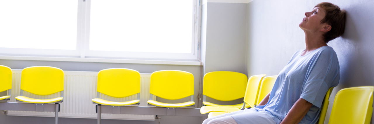 Waiting for Answers, Appointments When Undiagnosed and Chronically Ill woman sitting in a waiting room at a doctor's office