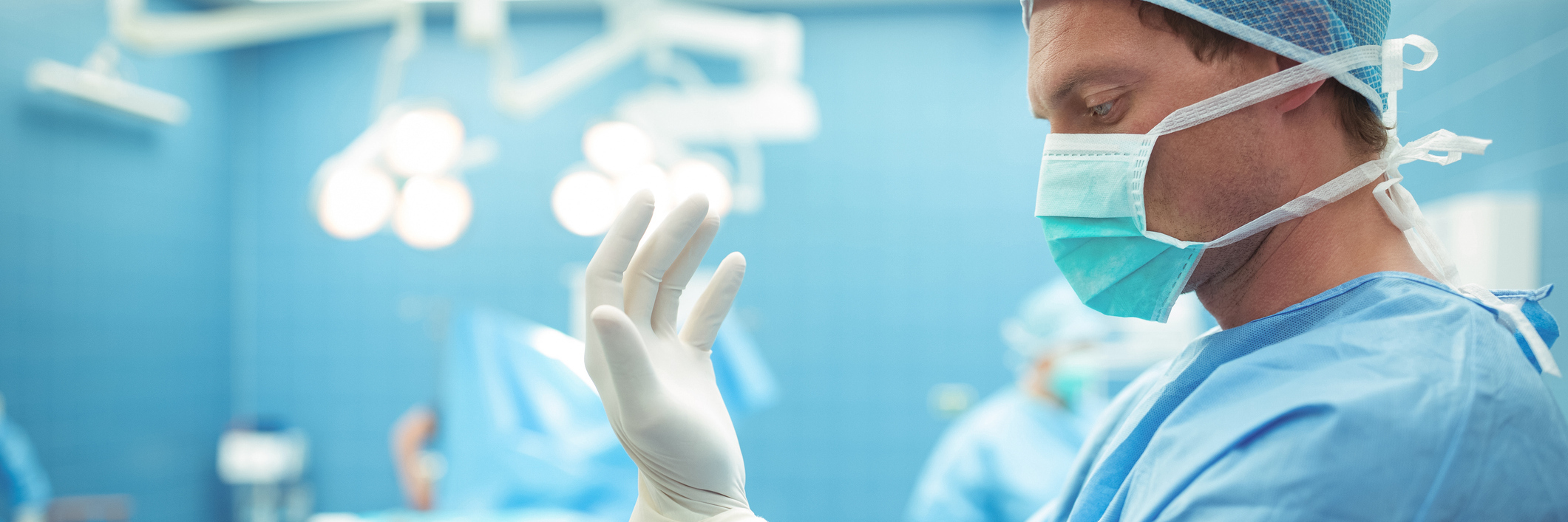 Gastroparesis: What to Expect During an Esophageal Manometry doctor putting on surgical gloves before a procedure