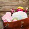 Mother's handbag with items to care for child