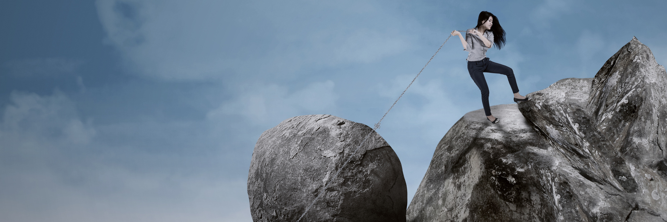Growing Stronger From the Burden of Chronic Illness woman pulling a big rock uphill with a rope