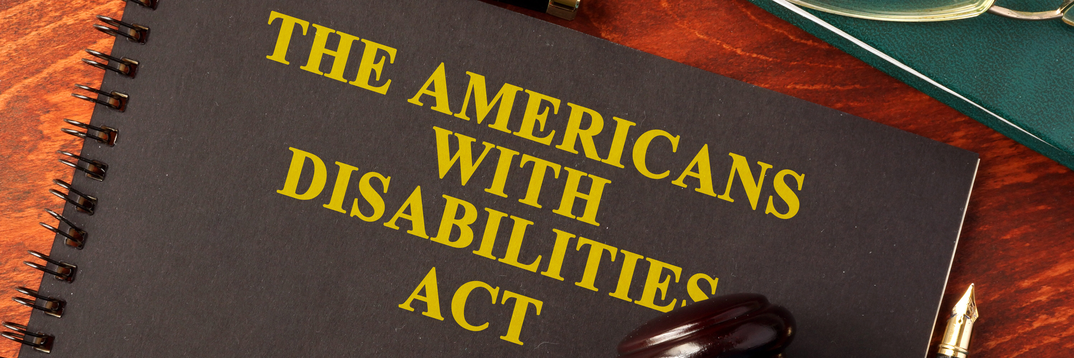 Employment of People With Disabilities Remains Low 27 Years After ADA Americans With Disabilities Act (ADA) notebook and gavel.