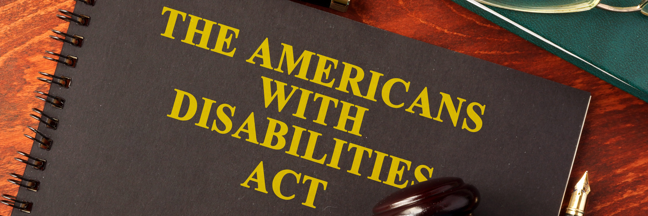 Americans With Disabilities Act (ADA) notebook and gavel.