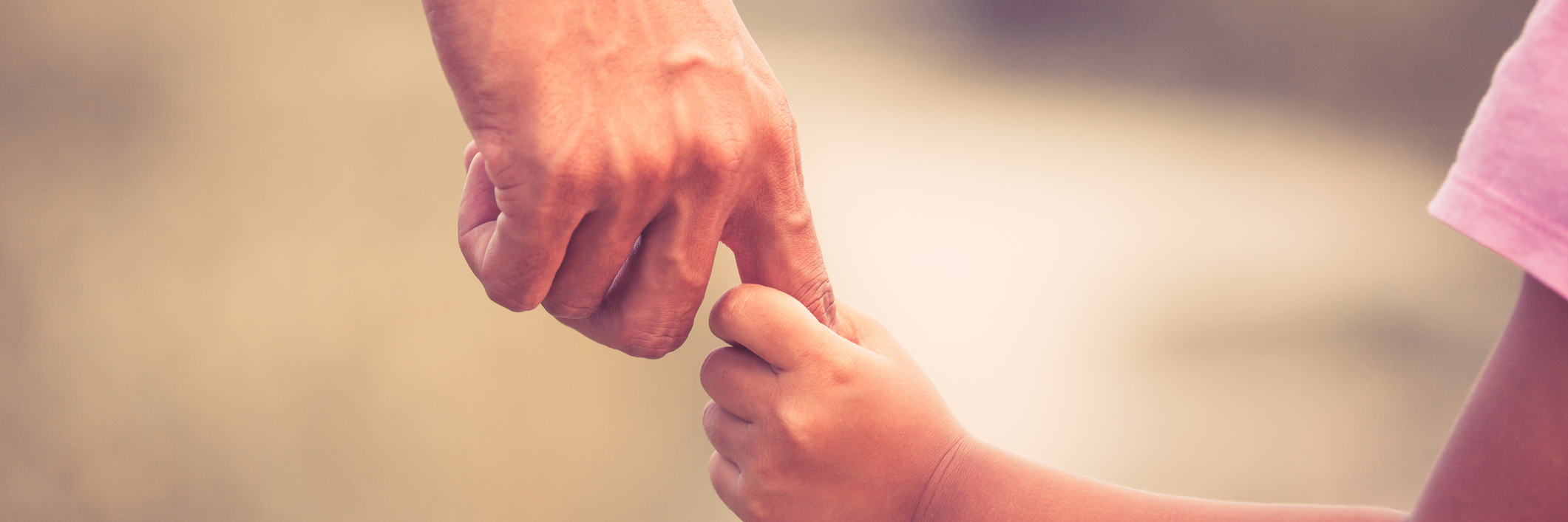 Method for Talking About Self-Harm With Son or Daughter vintage color photo of father and daughter holding hands together