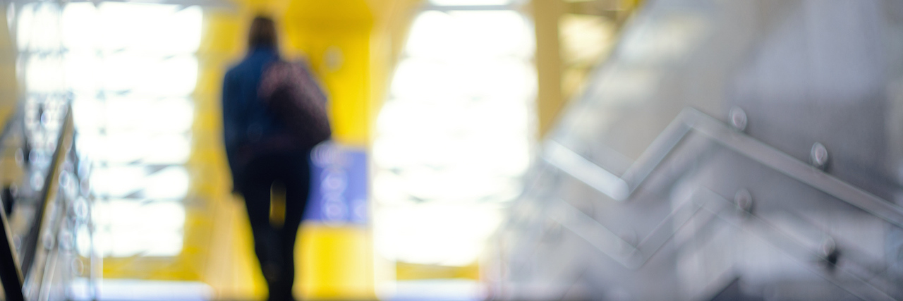 Why You Can’t Fix My Bulimia, but You Can Be Patient With Me A blurry woman walking up the stairs