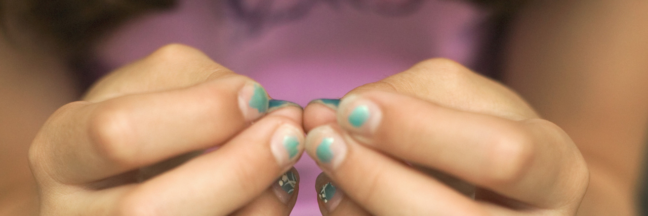The Problem With Calling Young Girls 'Beautiful' A girl with painted nails