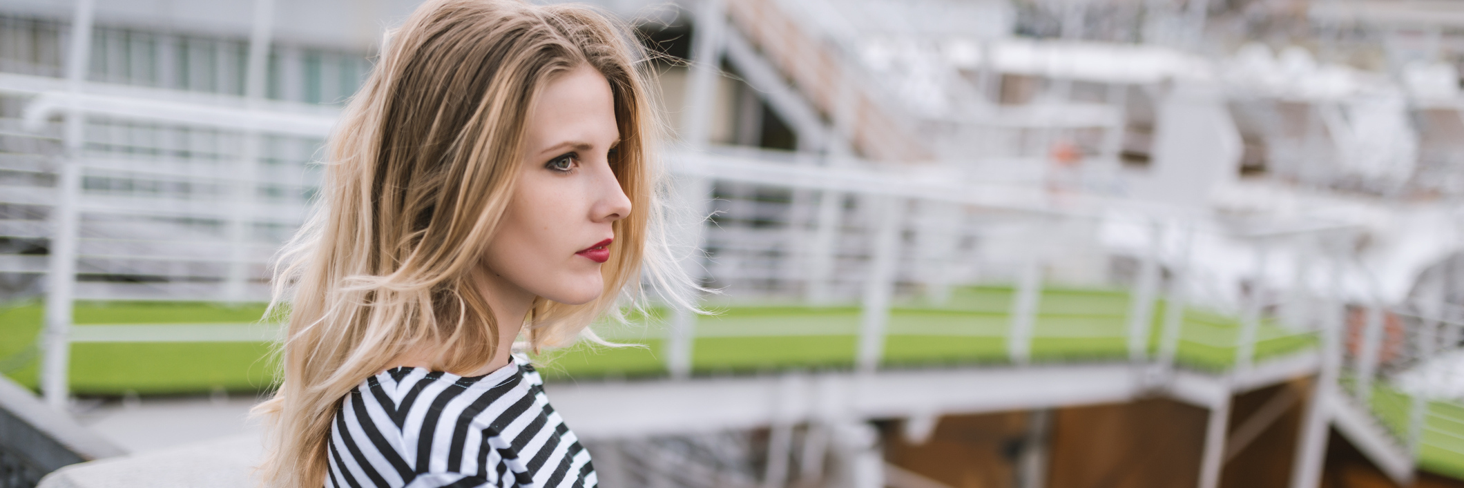 The Trouble With Having Medical Conditions That Won't Go Away A woman outside, with a serious expression.