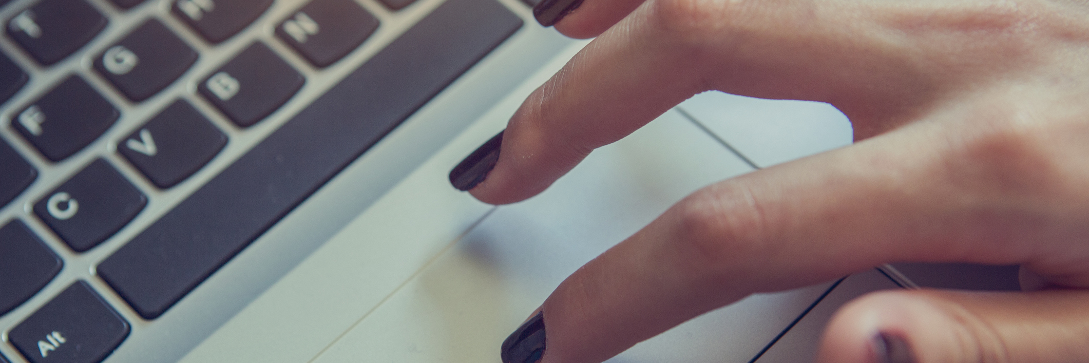 Typing on laptop closeup