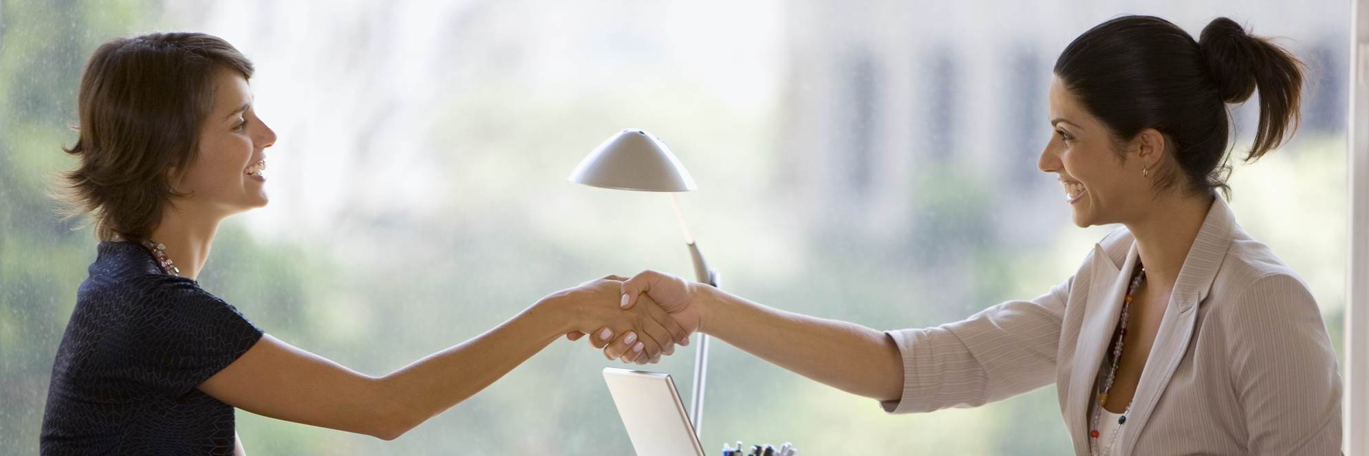 Employers Should Hire People With Invisible Illnesses and Disabilities Shaking hands at a job interview.