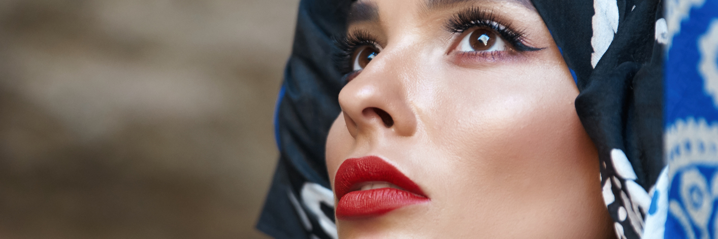 Why I Won't Stay Silent About My Condition, Like My Doctor Recommended Beautiful woman with a bandana on her head, looking toward sky.