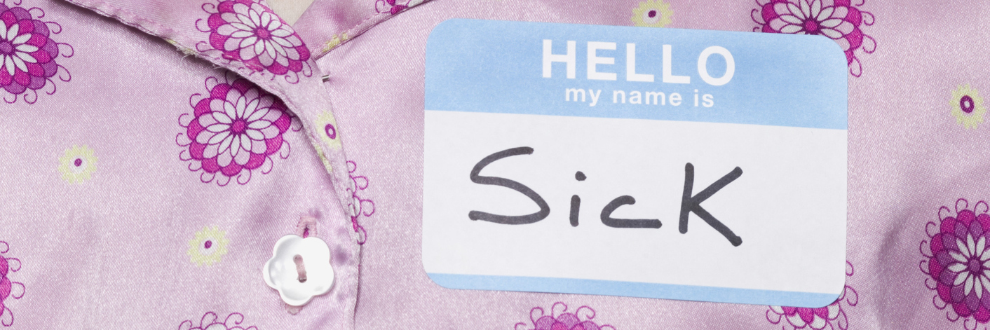 Living With Medical and Personal Labels When You Have Chronic Illness girl wearing pajamas with a nametag on her chest that says 'my name is 'sick''