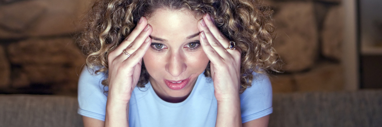 What It's Like to Fall in Love When You're an Overthinker A woman who looks stressed