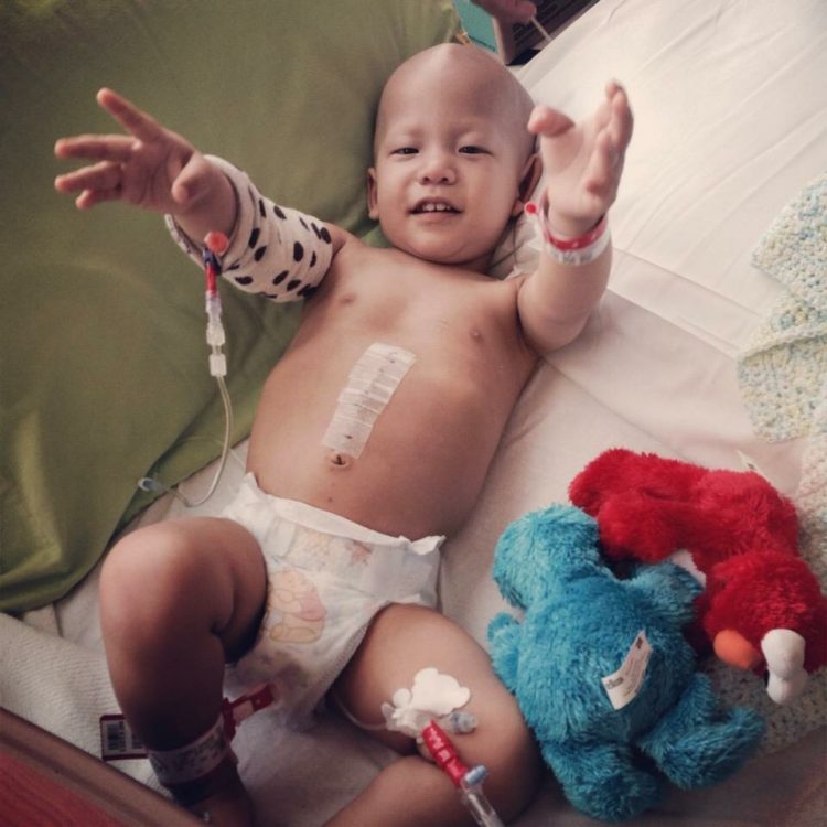 young pediatric patient lying in hospital bed