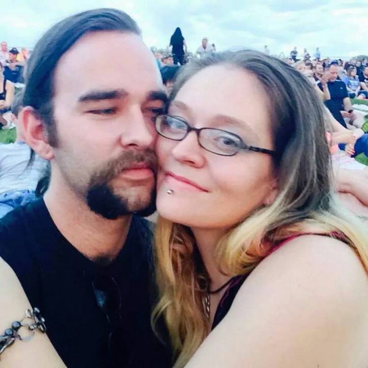 woman and her husband at a concert