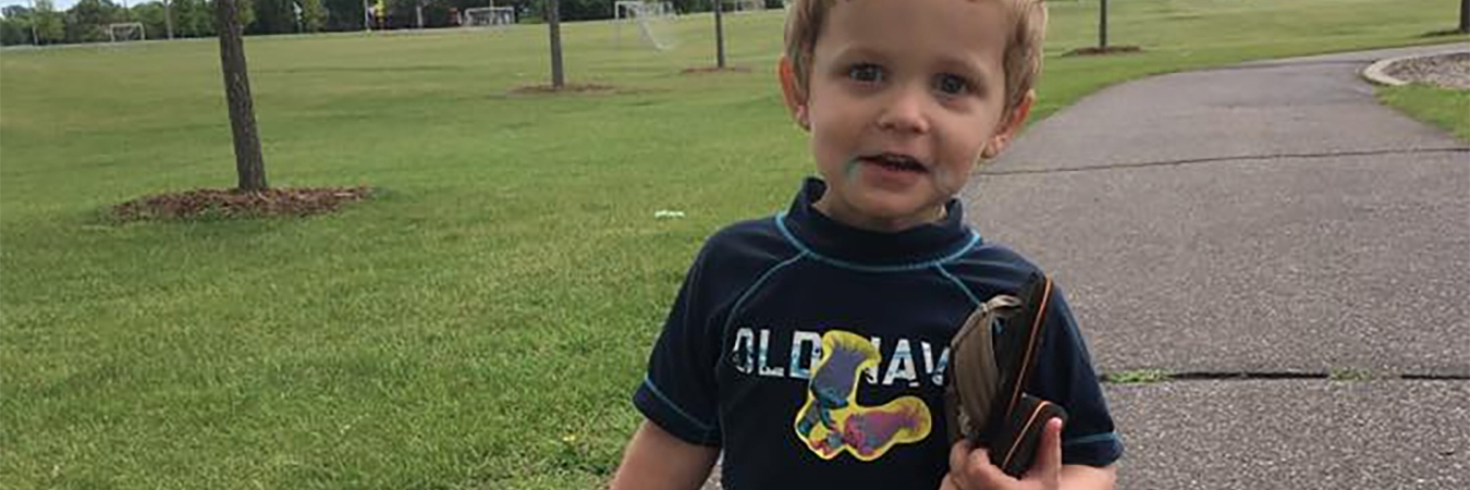 Recovery From Postpartum OCD After Birth of Second Son young boy smiling in nature