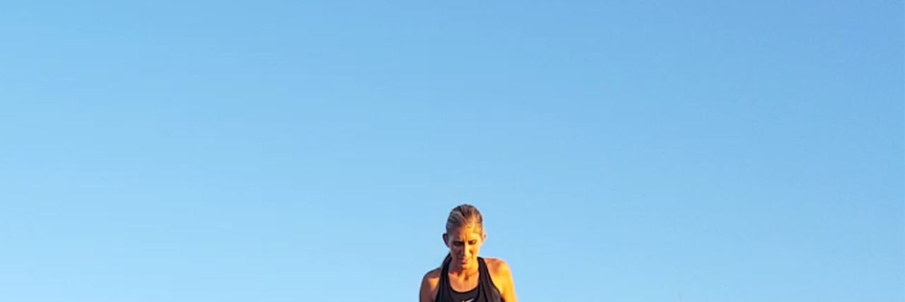 To My Younger Self and Others Struggling With an Eating Disorder a girl on the mountain looking down