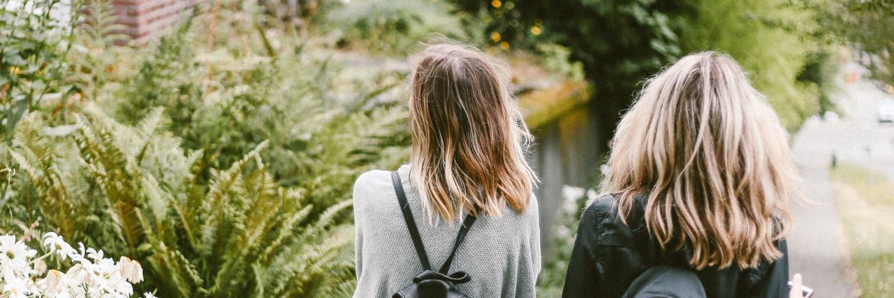 To My Best Friend Who Worries About My Mental Illness two girls wearing backpacks walking down the street together