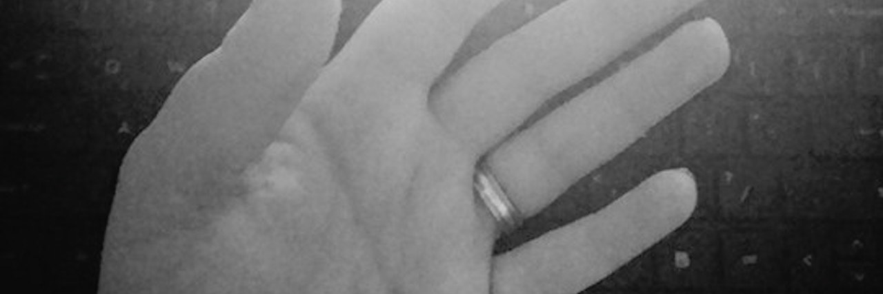 Being Unable to Write, Work Due to Hand Pain From Fibromyalgia black and white photo of the reflection of a woman's hand in her computer screen