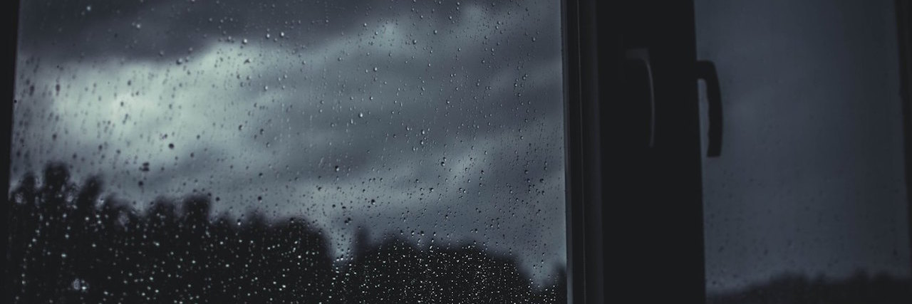 Poem: What It's Like to Be Functionally Suicidal a window showing a dark sky
