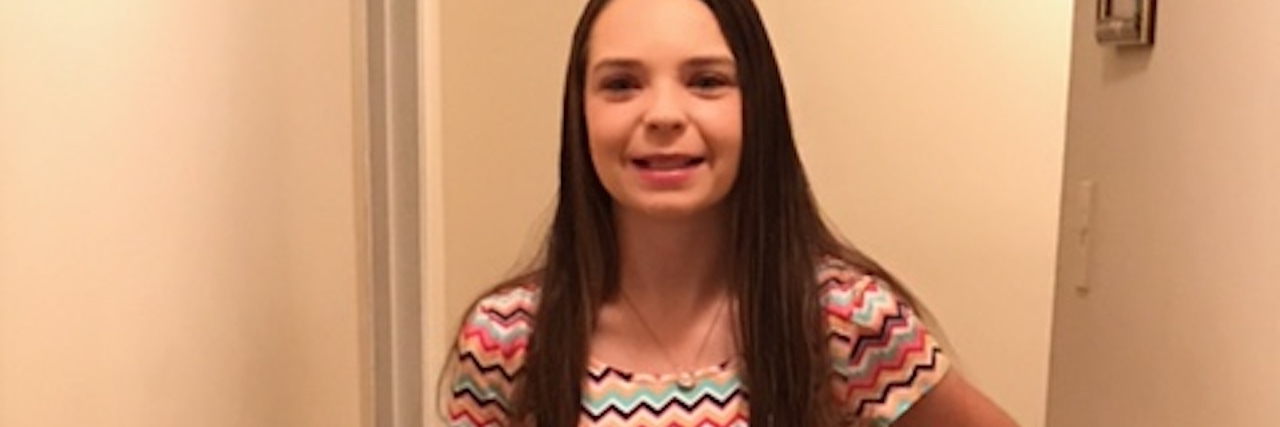 What Living With Gastroparesis Has Taught Me woman posing in a crop top with a feeding tube attached to her stomach