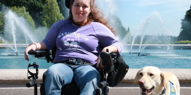 Macy with her service dog.