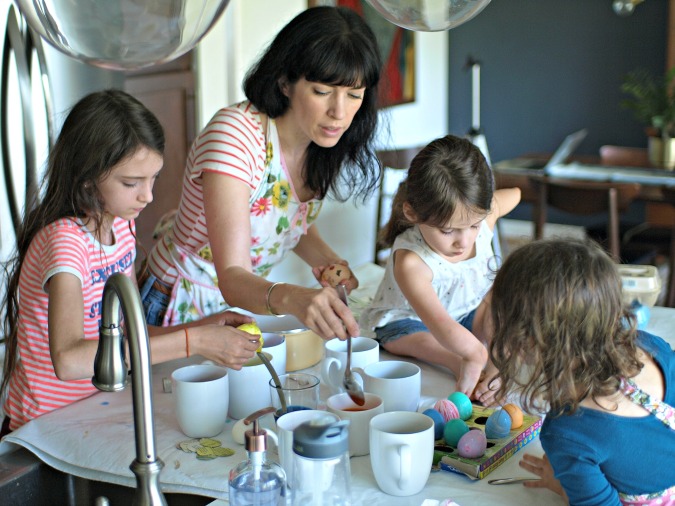 Lamp and family dying Easter eggs