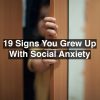 boys hand sticking out of closed door. Text reads: 19 signs you grew up with social anxiety