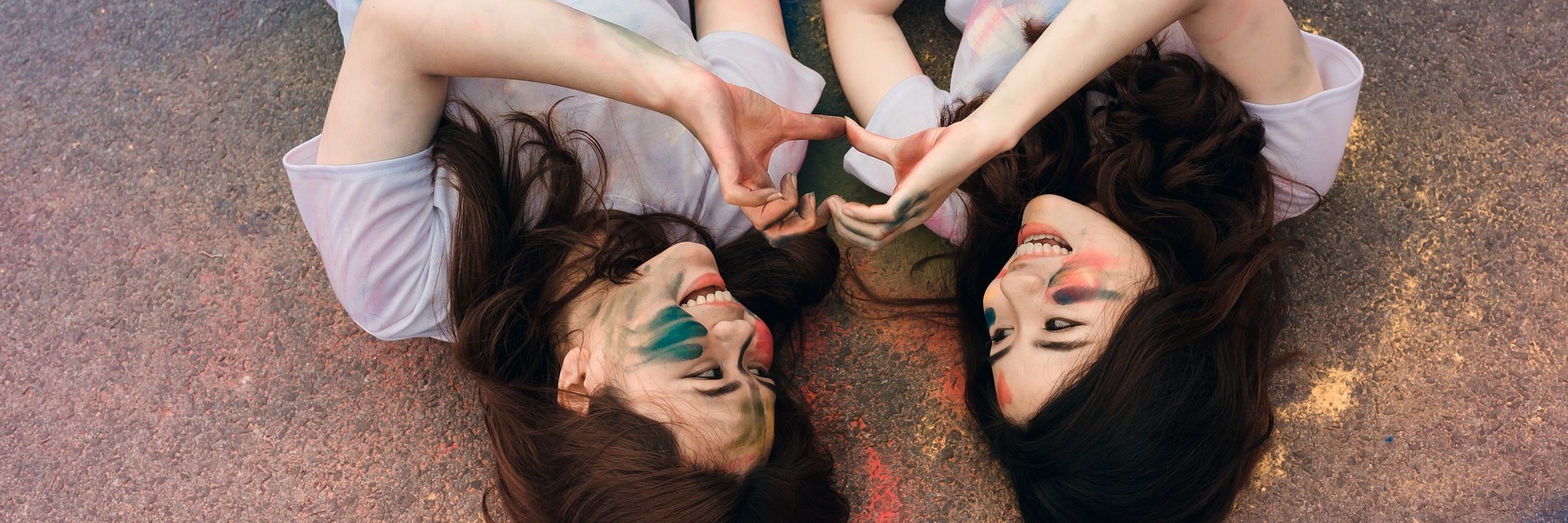 Autism and the Importance of Social Skills Friends playing in paint.