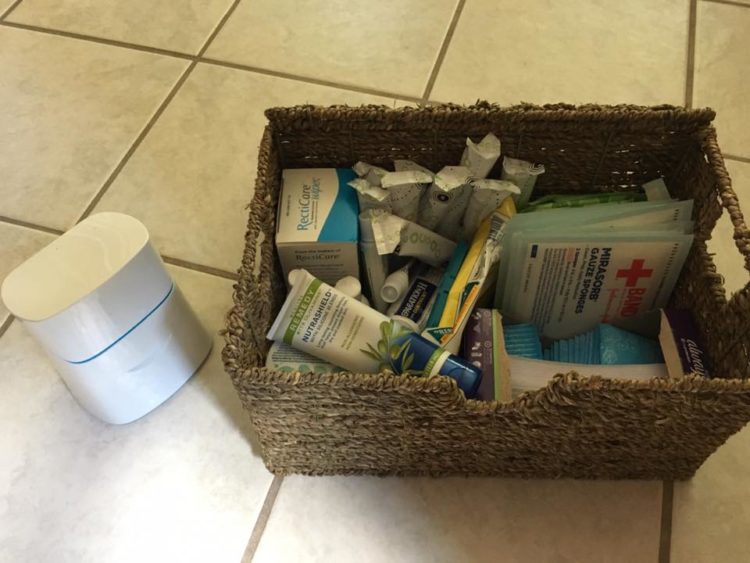 basket of medical supplies in bathroom