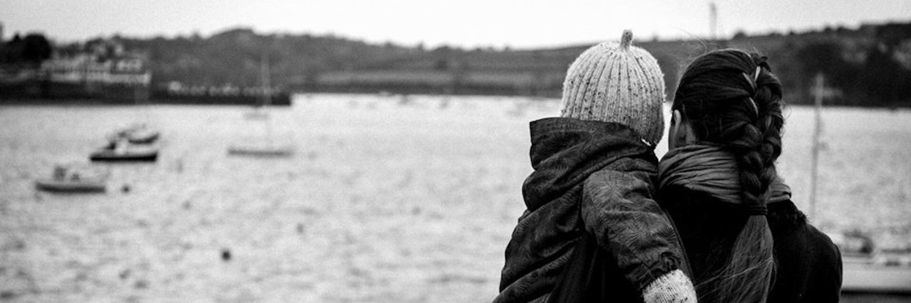 Does My Autism Affect My Parenting? The author holding her son, watching ships in the water