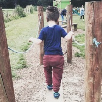 Boy walking down a path at playground