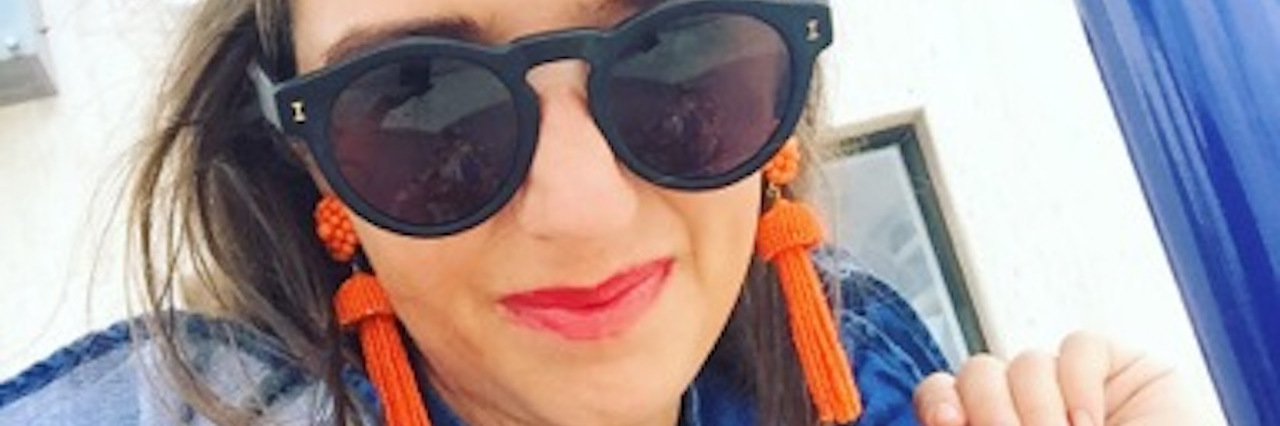 Weird Symptoms Experienced During Two-Week Migraine, Brainstem Aura woman in sunglasses waiting for the bus