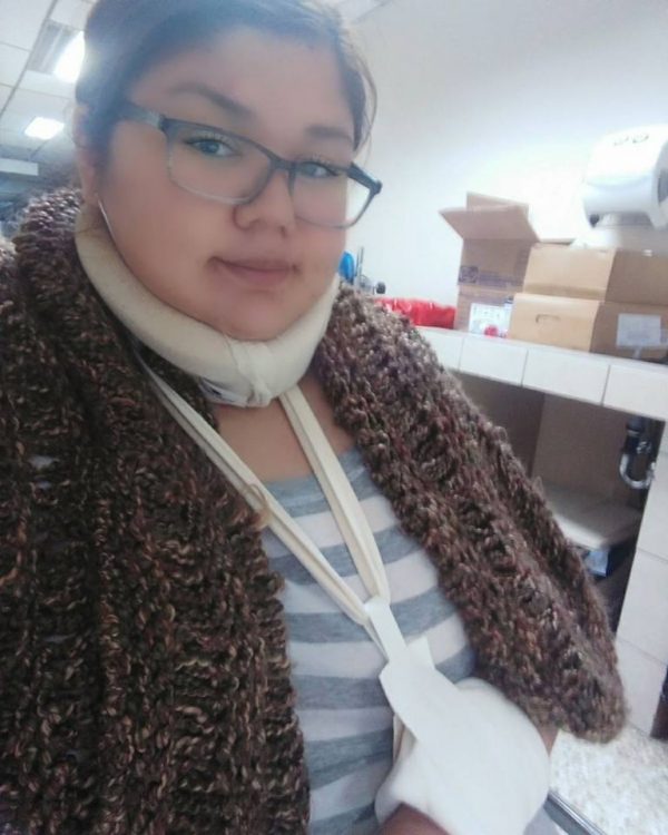 woman wearing neck brace in the hospital
