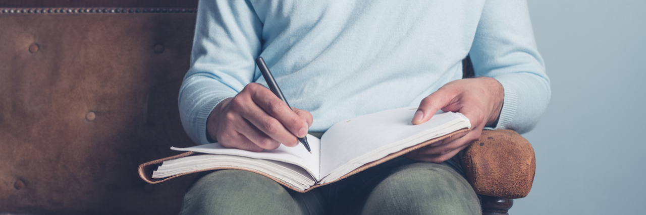 A Note for My Friends and Family in Case I Become Suicidal a man writing in notebook