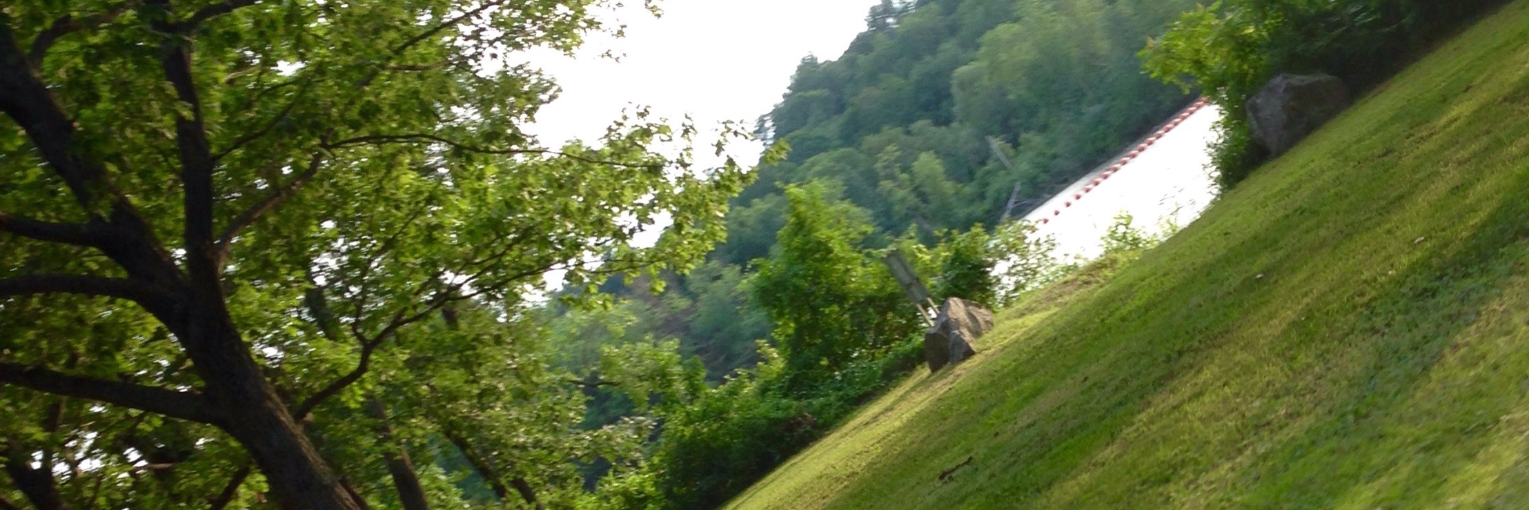What I Found When I Returned to the Place I Wanted to Die image of lake and rocky outcrop taken from car