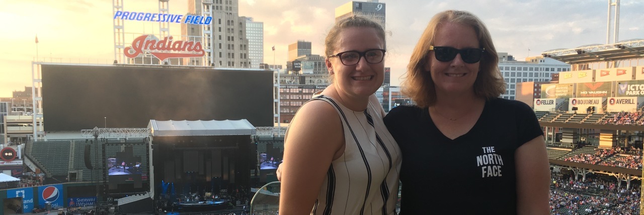 Tips for Going to Concerts With Dysautonomia two women at a concert