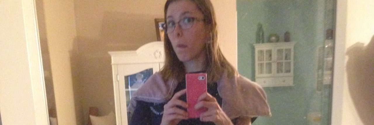 Fibromyalgia: Visible Signs of My Invisible Illness woman wearing a heat pack around her shoulders before bed