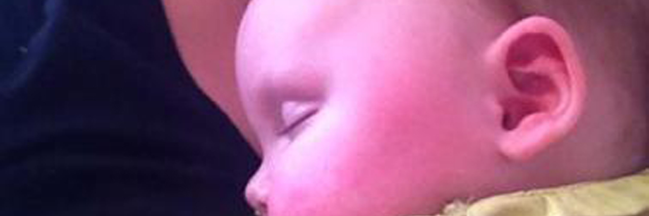 Learning to Embrace Fear After Losing My Child to Brain Cancer mom holding young daughter with brain cancer