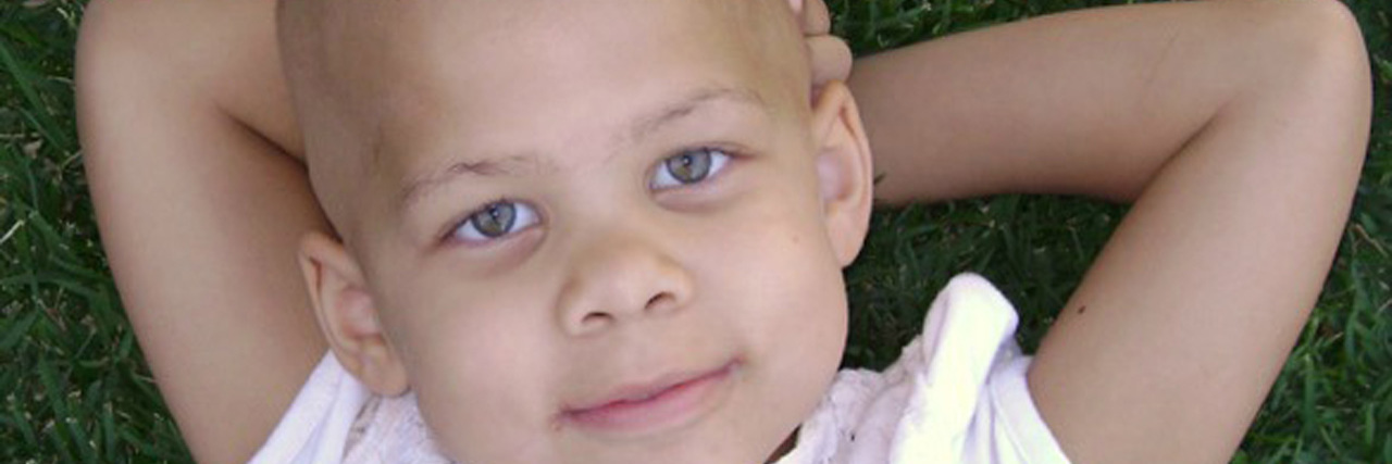 12-Year-Old Childhood Cancer Survivor Shaves Head to Raise Awareness Lily childhood cancer survivor watching clouds
