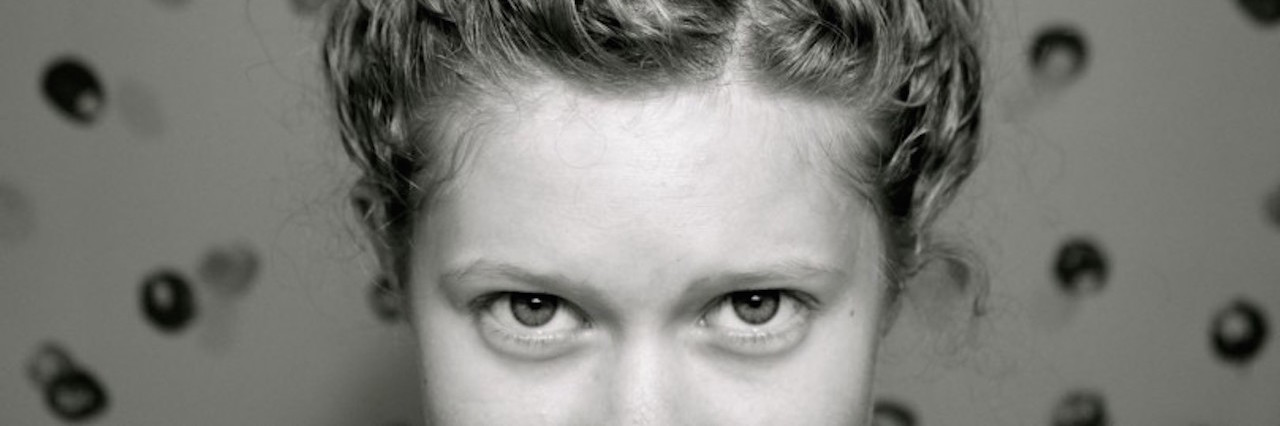 A close-up of the writer's eyes and forehead.